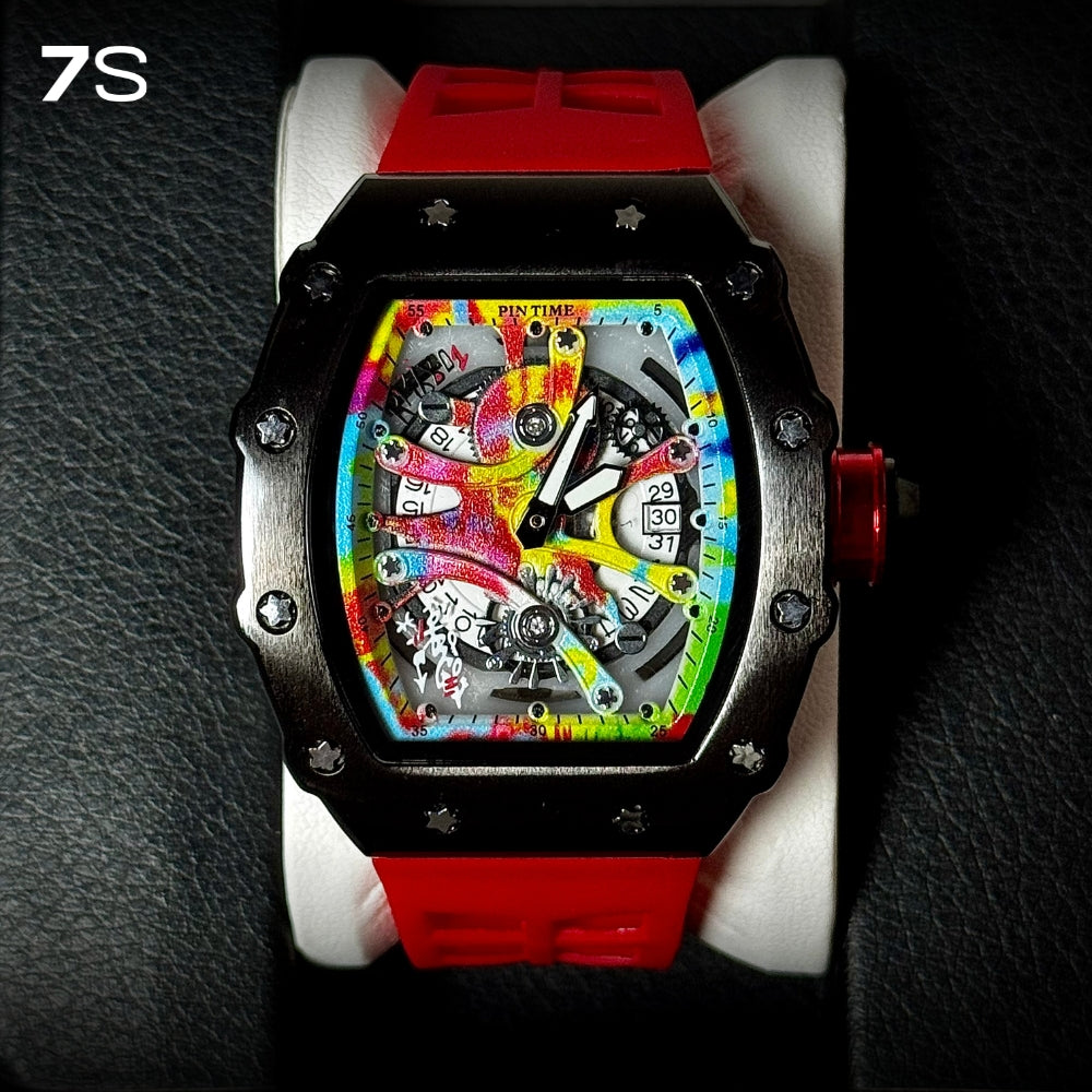 Relógio masculino 7SUIT Graffiti com caixa preta escovada, mostrador colorido estilo grafite e pulseira de silicone preta. Visual ousado para homens com personalidade forte.